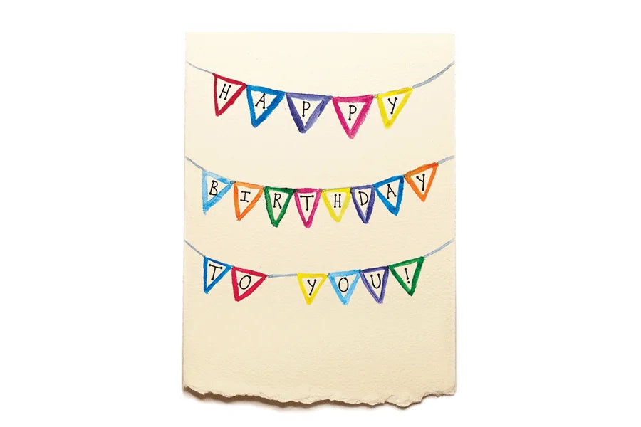 Colorful birthday banner on a beige background