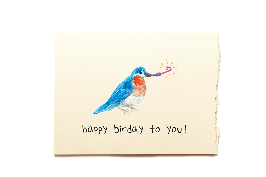 Birthday card with a colorful bird illustration and 'happy birthday to you!' text on a beige background