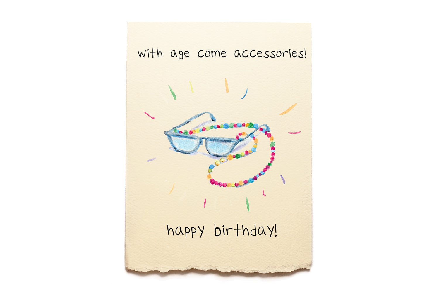 Birthday card with sunglasses and beaded chain on a beige background
