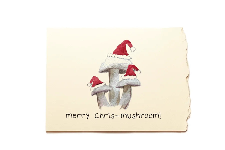 Card with mushrooms wearing Santa hats and text 'merry chris-mushroom!' on a beige background