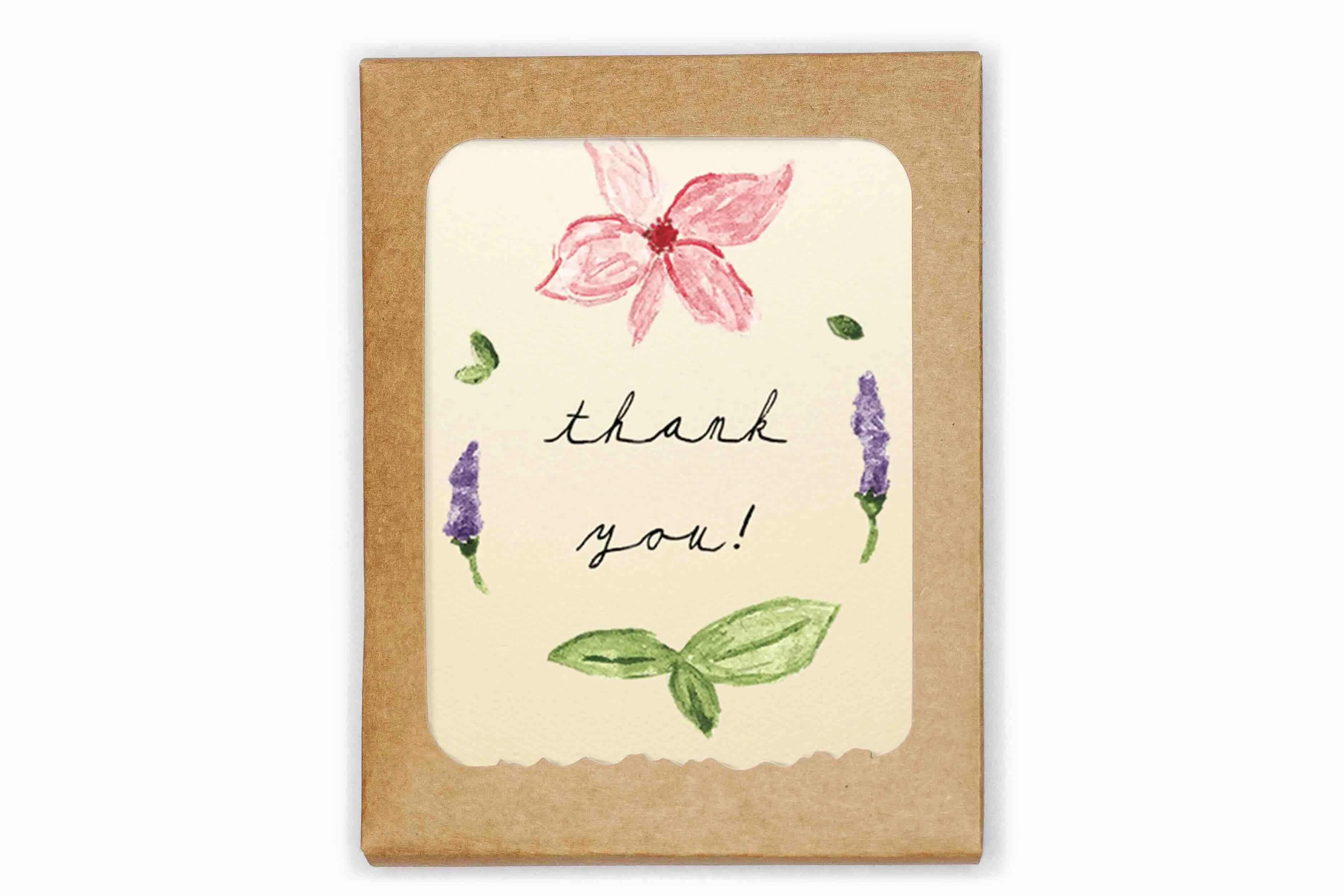 Greeting card with floral design and 'thank you!' text on a kraft paper background
