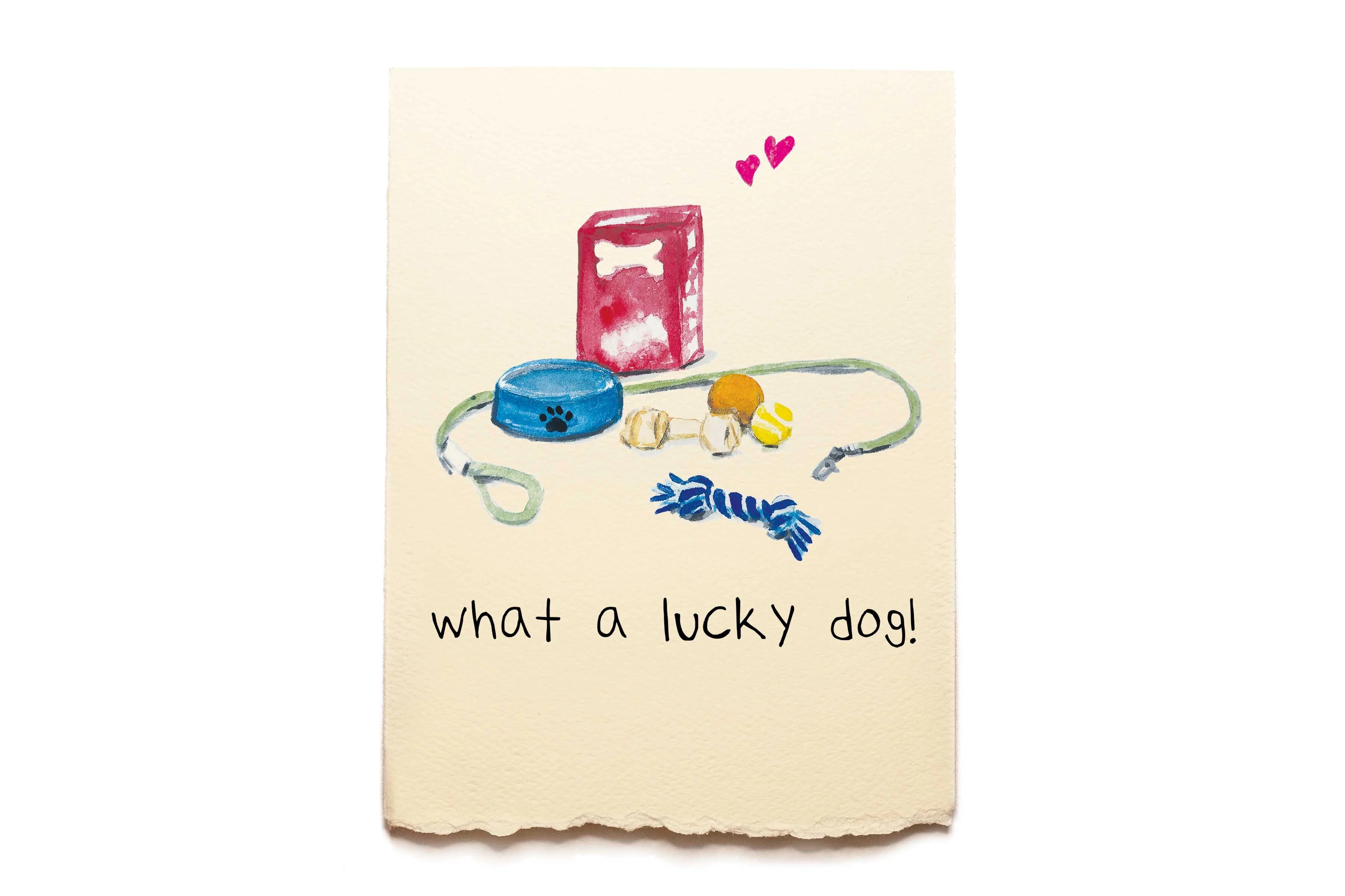 Card with dog toys and accessories on a beige background with 'what a lucky dog!' text.