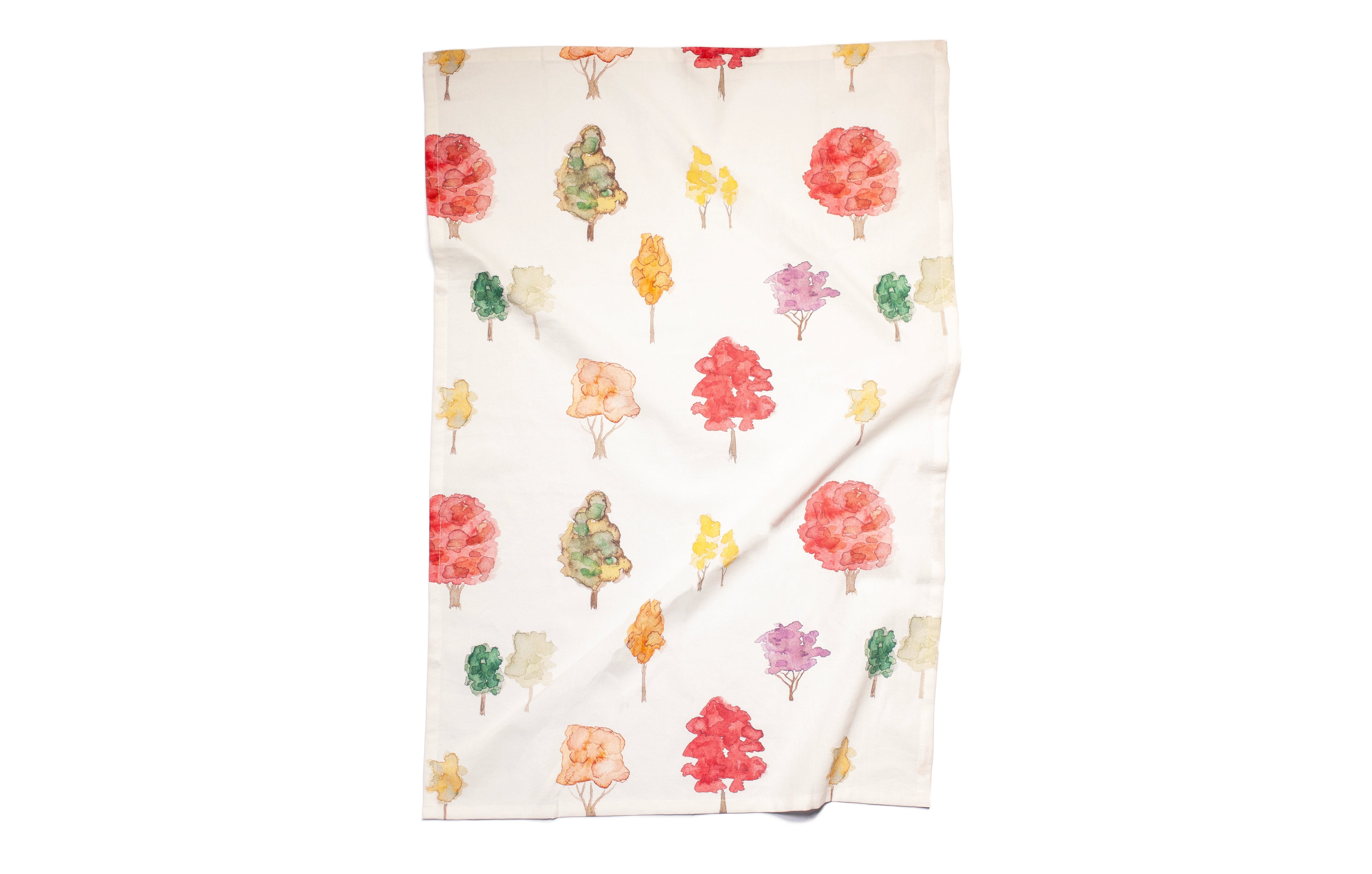 Folded fabric with colorful tree pattern on a white background