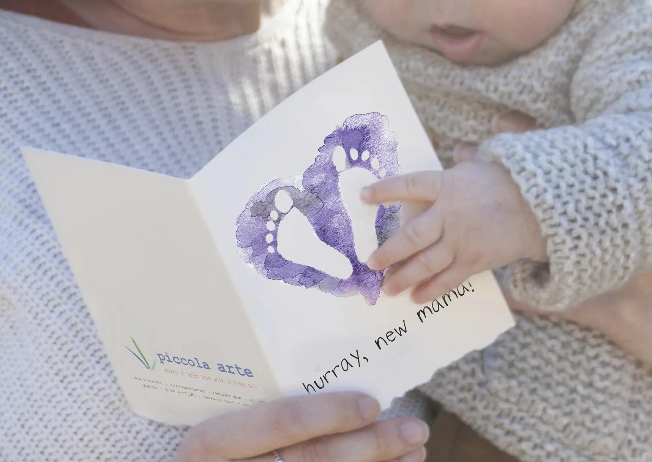 Mother and baby holding greeting card that says "hurray, new mama!"