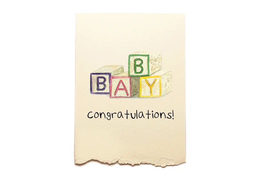 Baby shower card with colorful block letters spelling 'BABY' on a beige background