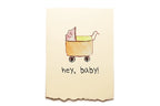 Note with a baby in a stroller illustration and 'hey, baby!' text on a beige background