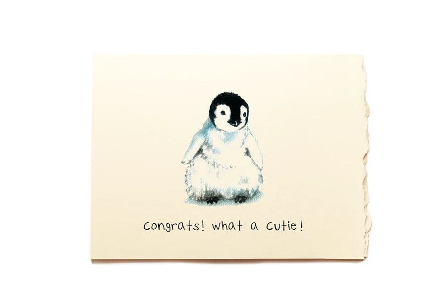 Note card with a penguin illustration and text on a beige background