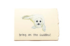 Note with a dog illustration and text 'bring on the cuddles!' on a beige background