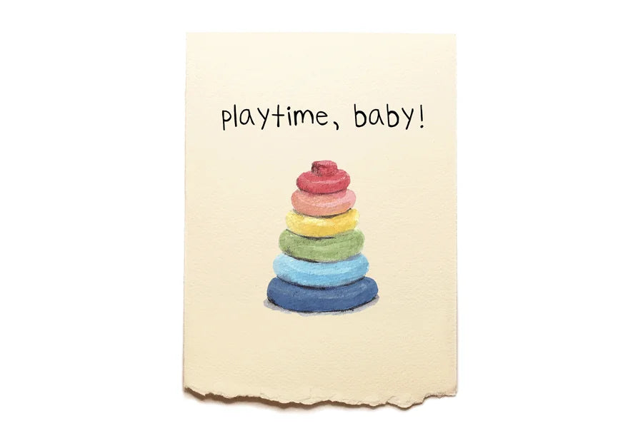 Colorful stack of rings on a beige card with 'playtime, baby!' text