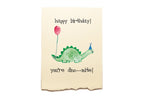 Birthday card with a dinosaur holding a balloon and text 'happy birthday! you're dino-mite!' on a beige background