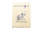 Birthday card with an elephant holding a balloon and text on a beige background