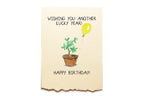 Birthday card with a cactus and yellow balloon on a beige background