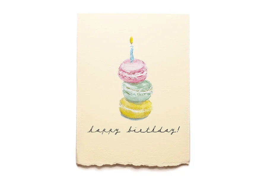 Happy Birthday card with colorful macaron stack and candle on a beige background