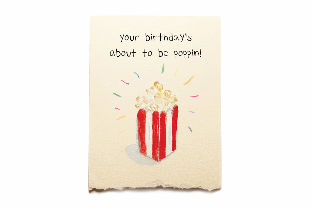Birthday card with popcorn illustration and text 'your birthday's about to poppin!' on a beige background