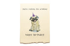 Birthday card with a pug wearing a party hat and text on a beige background