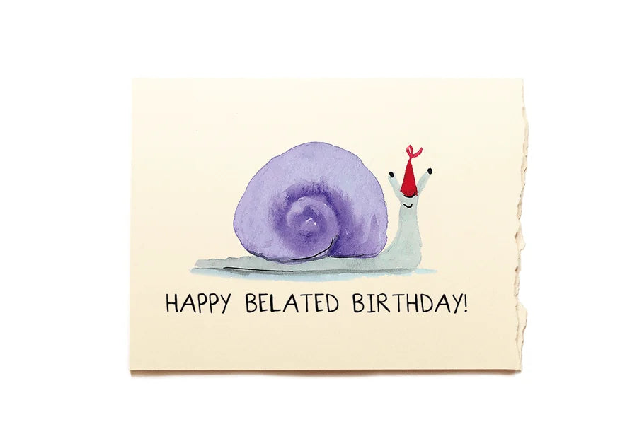 Greeting card with a purple snail and red hat on a beige background, featuring the text 'Happy Belated Birthday!'.