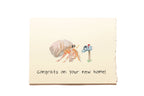 Card with a hermit crab and mailbox illustration and 'Congrats on your new home!' text.