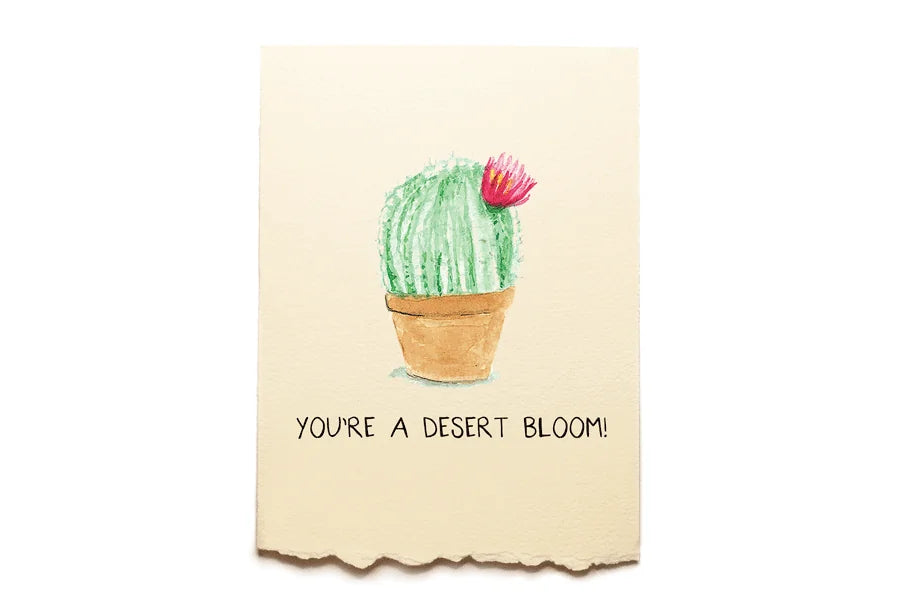 Card with a cactus illustration and text 'You're a desert bloom!' on a beige background
