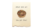 Motivational card with a donut and text on a beige background
