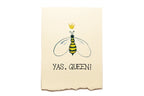 Beige towel with a bee illustration and 'YAS, QUEEN!' text on a white background