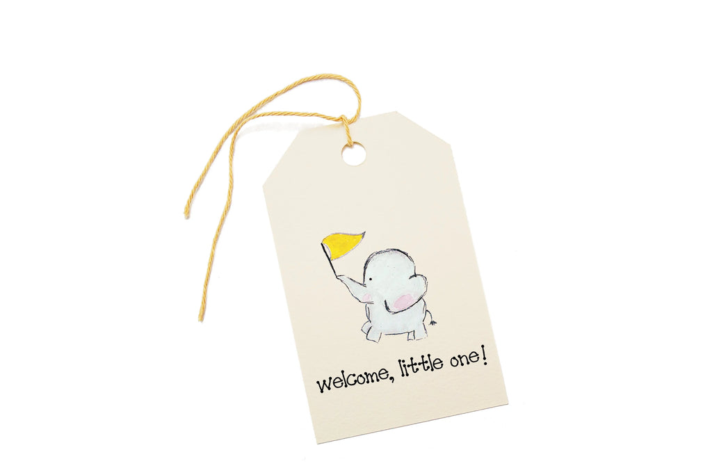 Gift tag with a baby elephant holding a yellow flag and 'Welcome, little one!' text on a white background.