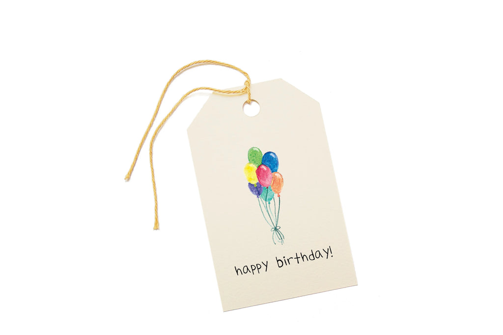 Gift tag with balloons and 'happy birthday!' text on a white background.