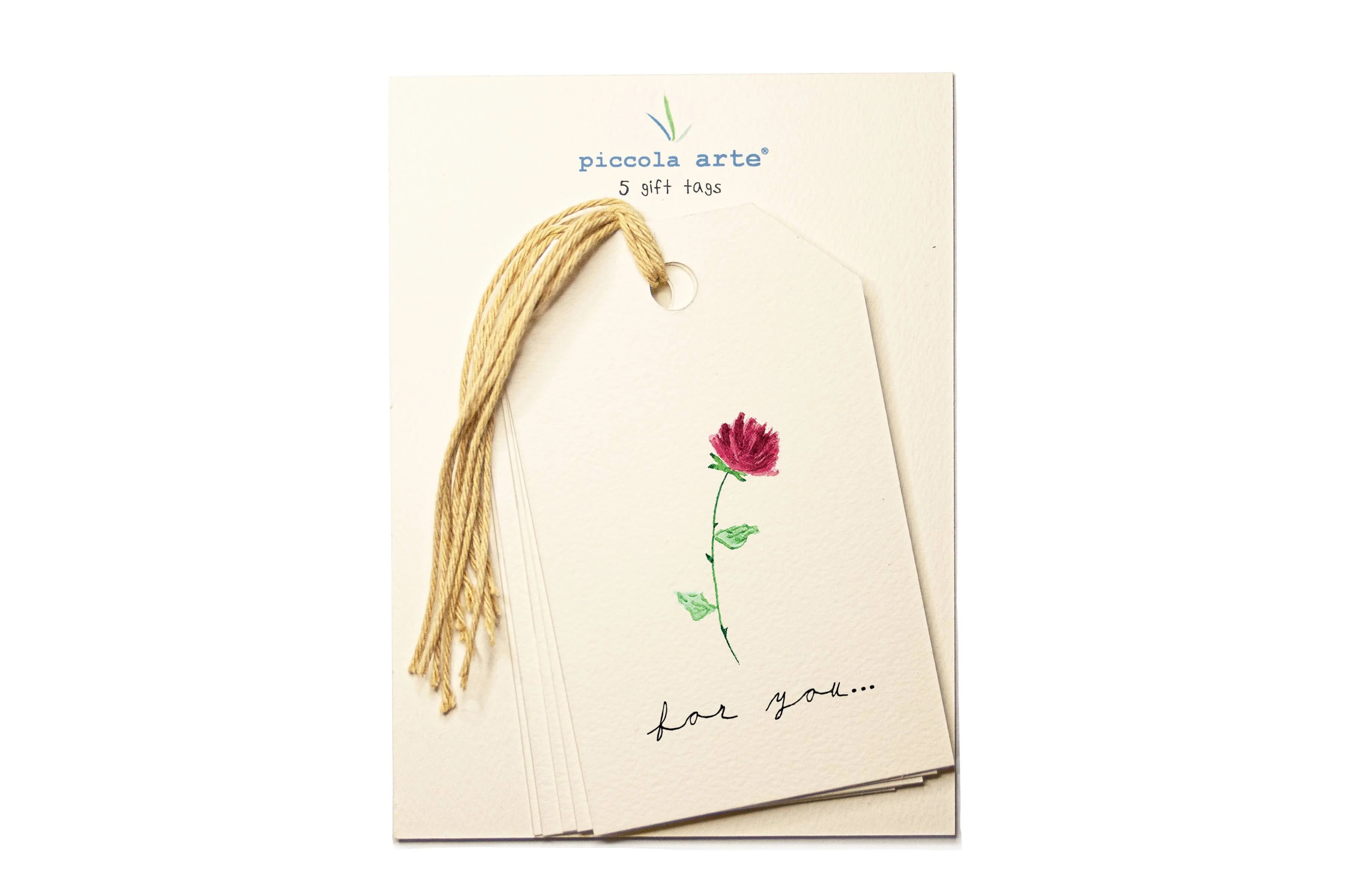 Packaging of Piccola Arte gift tags with a flower design and text on a white background