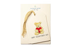 Packaging of Piccola Arte gift tags with a teddy bear holding a heart on a white background