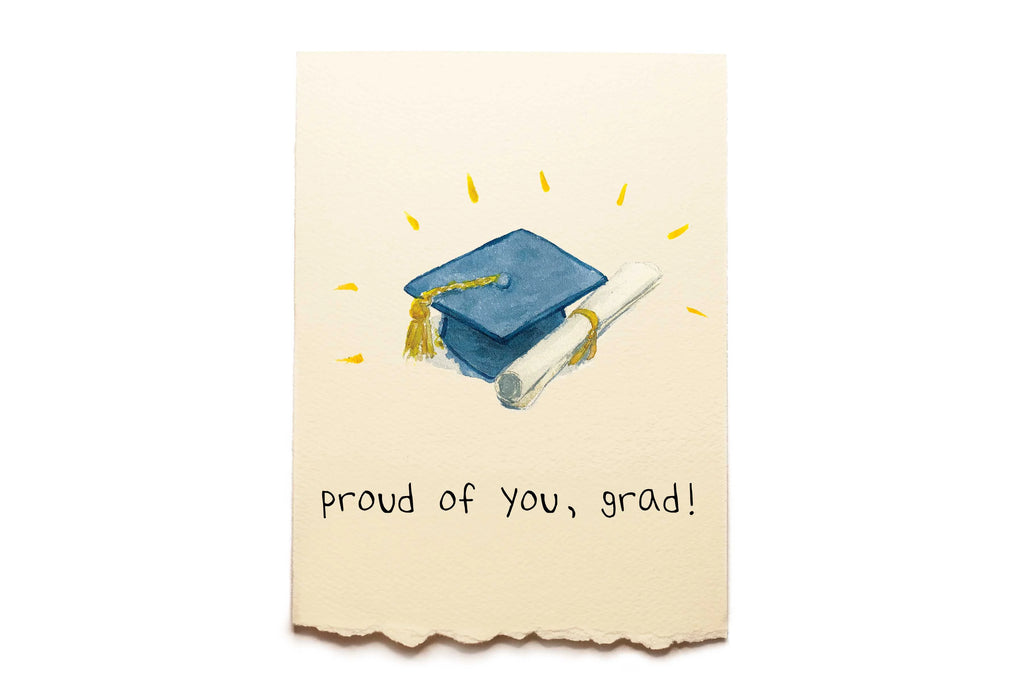 Graduation-themed card with a blue cap and diploma on a beige background with 'proud of you, grad!' text.