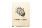 Card with a turkey illustration and 'Gobble! Gobble!' text on a beige background