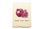 Card with pomegranates and 'happy new year!' text on a beige background
