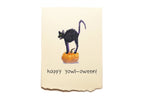 Halloween-themed card with a black cat on a pumpkin and 'happy yowl-oween!' text.