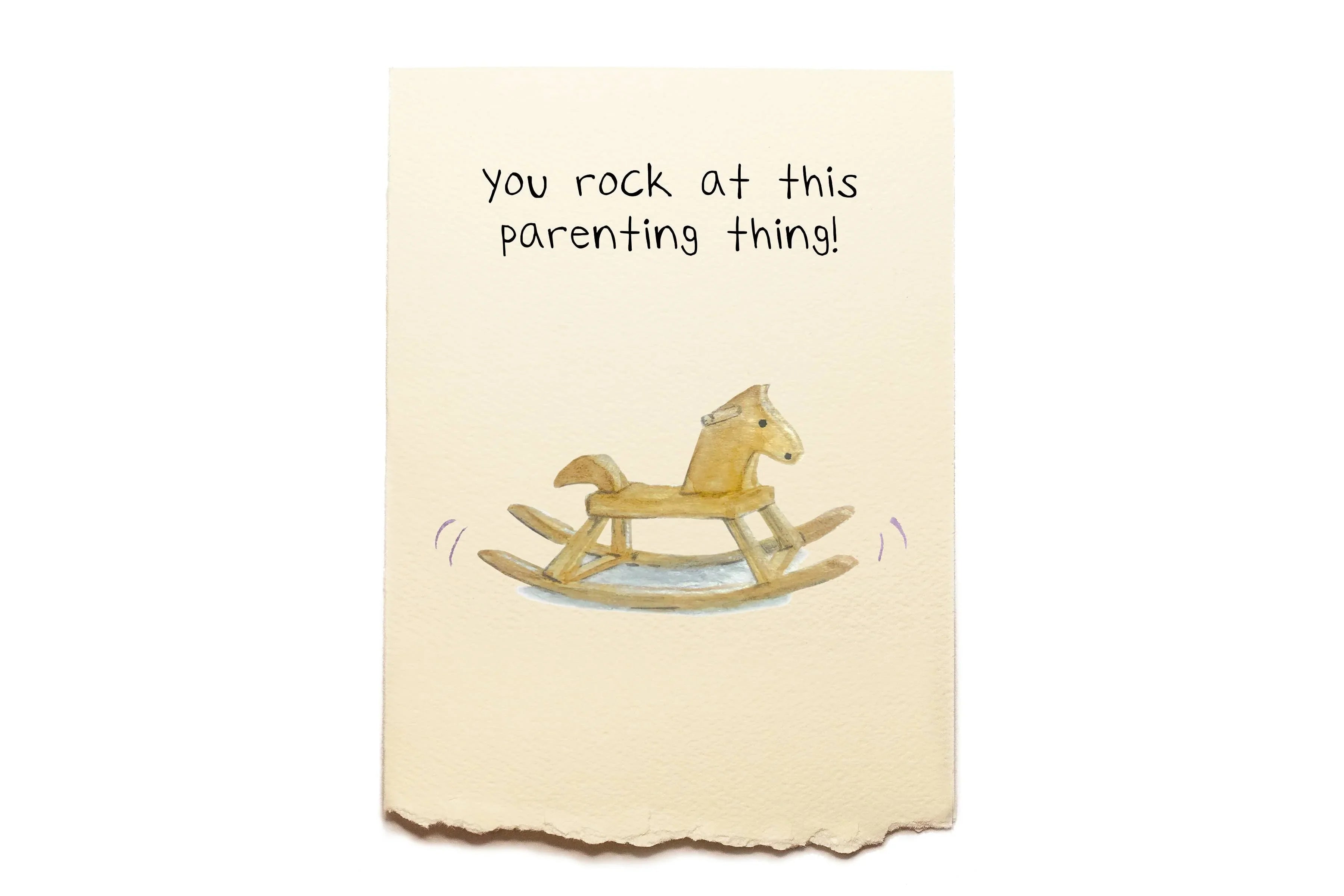 Card with a rocking horse illustration and text 'you rock at this parenting thing!' on a beige background