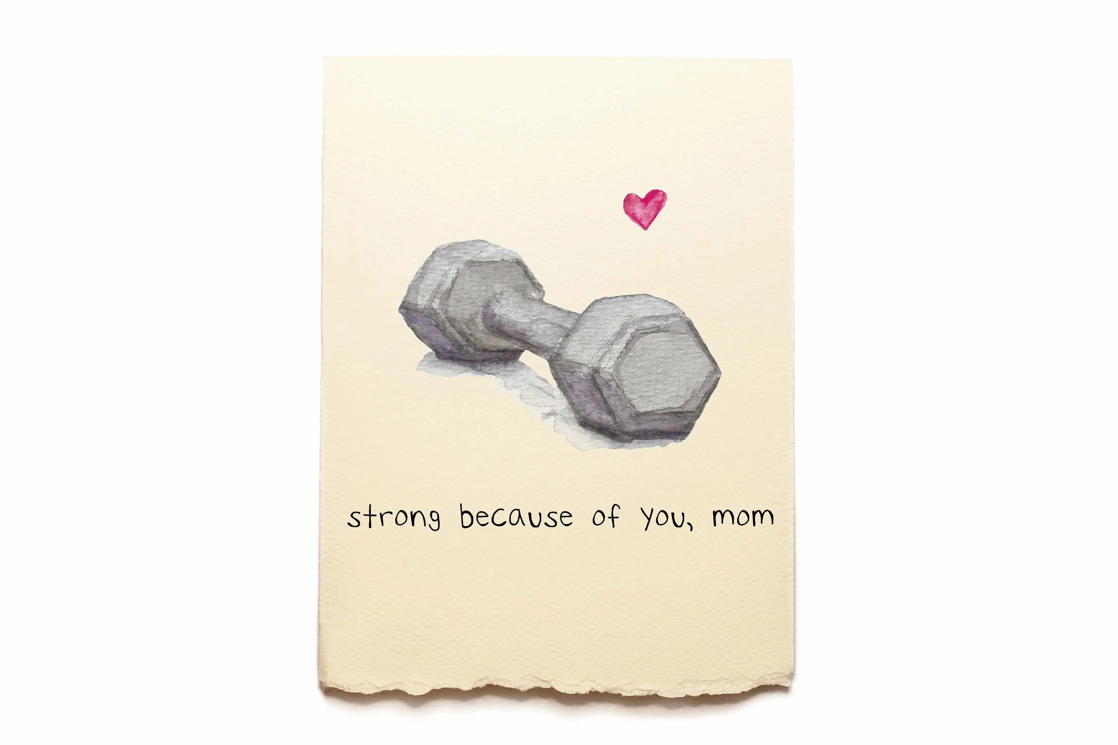 Note with a dumbbell drawing and text 'strong because of you, mom' on a beige background