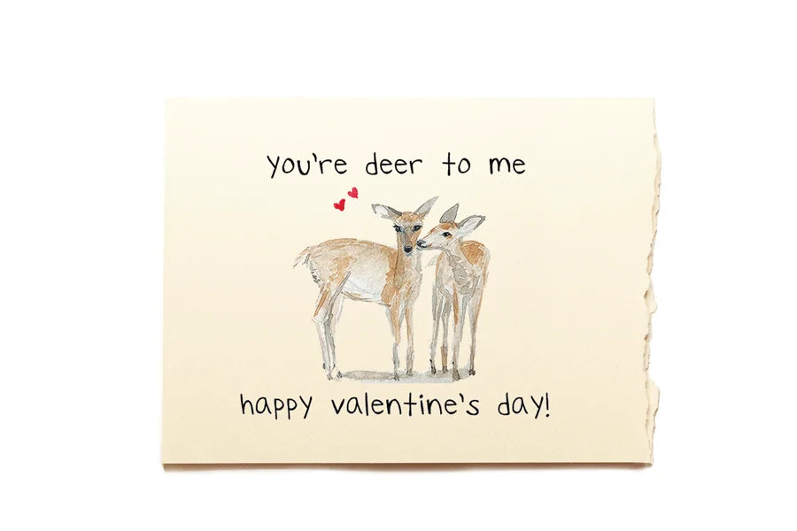 Valentine's Day card with two deer and text 'you're deer to me, happy Valentine's day!' on a beige background