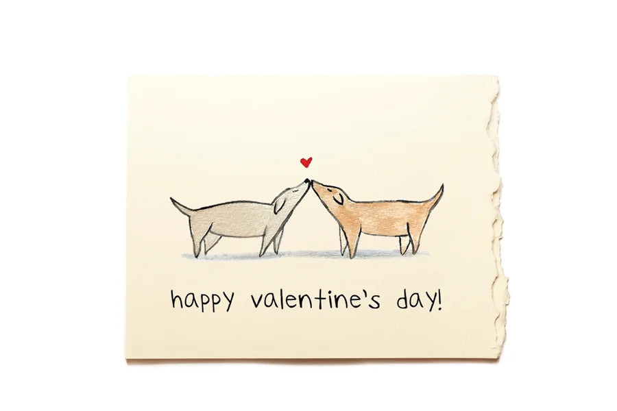 Valentine's Day card with two dogs kissing and a heart above them on a beige background with the text "Happy Valentine's day!".