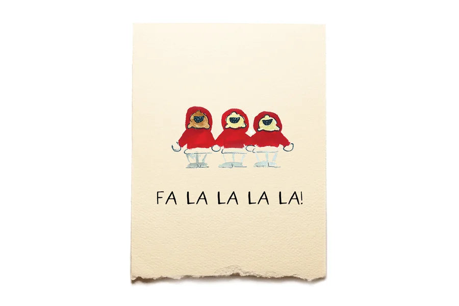 Notebook with three red-suited figures and 'FA LA LA LA LA!' text on a beige background