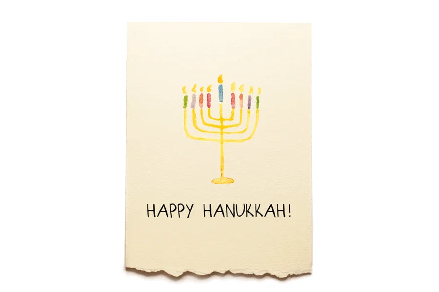 Card with a Menorah illustration and 'Happy Hanukkah!' text on a beige background