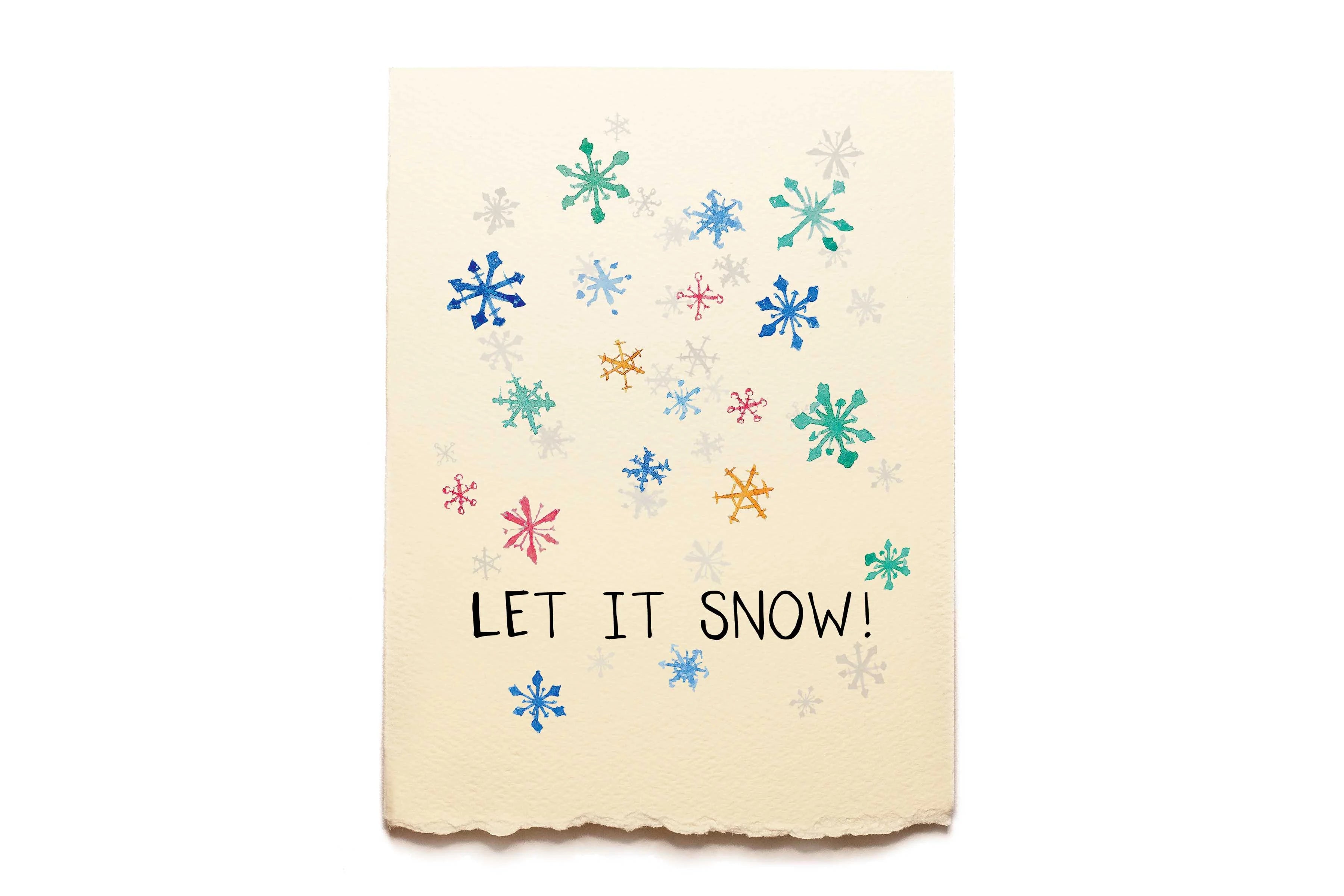 Beige card with colorful snowflakes and 'LET IT SNOW!' text on a white background