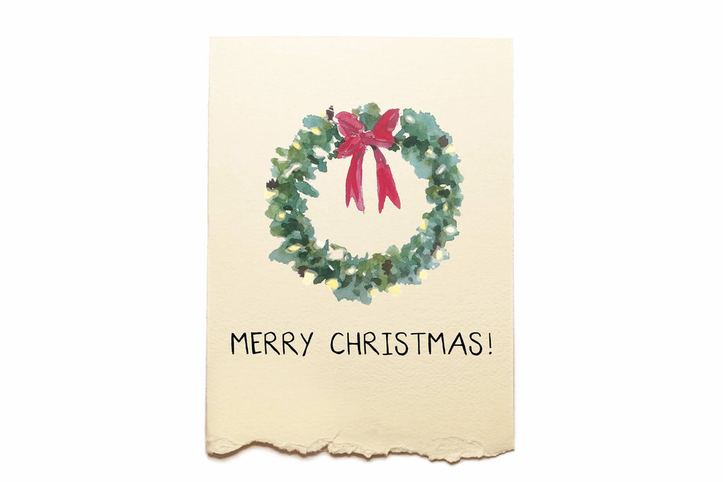 Christmas card with a wreath and red bow on a beige background