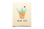 Notebook with a potted aloe vera plant illustration and 'Aloe You!' text on a beige background