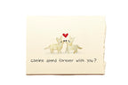 Card with two dogs and a heart, text 'Canine spend forever with you?' on a beige background