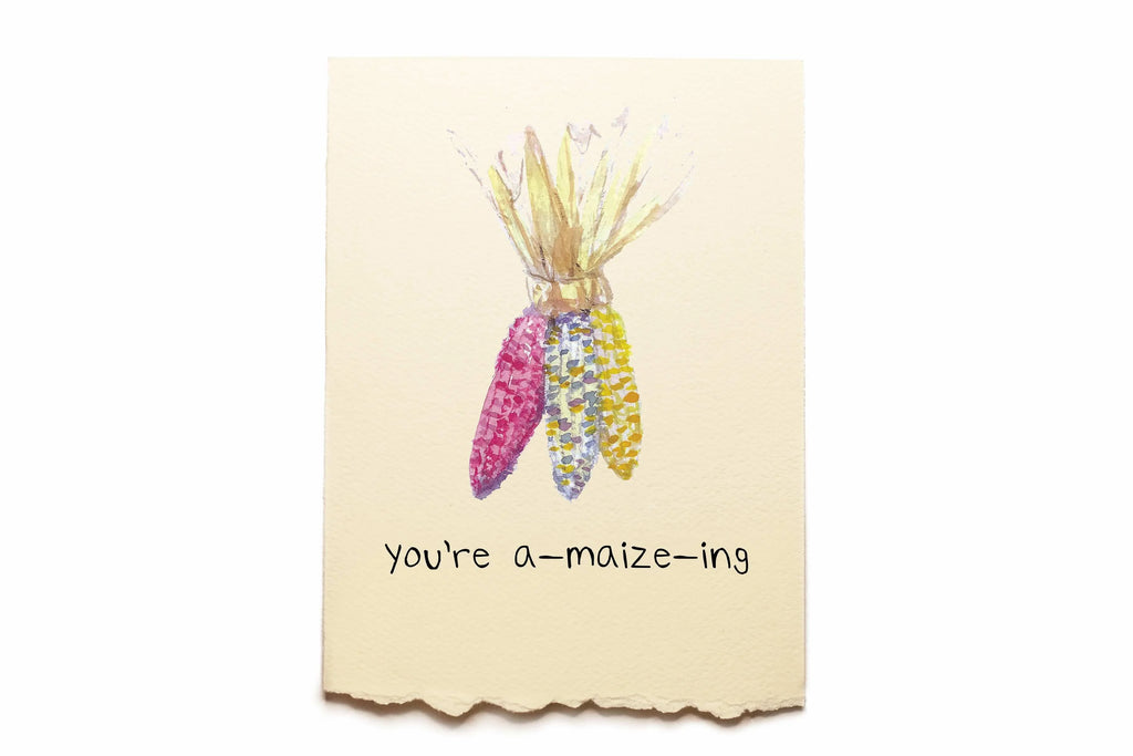 Card with colorful corn illustration and 'you're a-maize-ing' text on a beige background