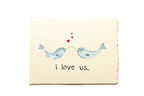 Card with two whales holding hands and 'i love us' text on a beige background