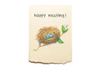 Card with a nest and eggs illustration and 'happy nesting!' text on a beige background