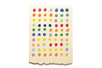Colorful polka dot pattern on a beige background