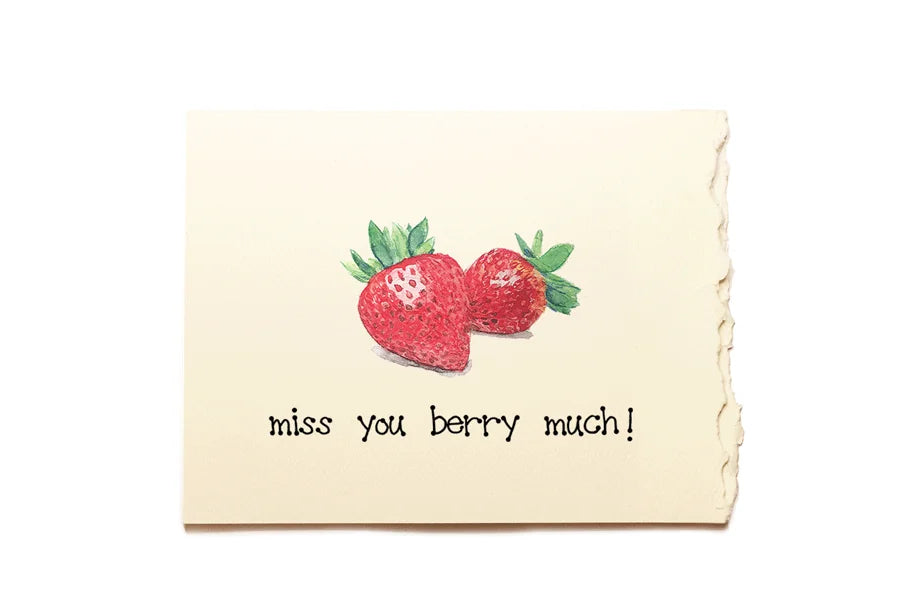 Card with strawberries and text 'miss you berry much!' on a beige background