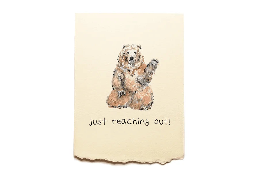 Card with a bear illustration and text 'just reaching out!' on a beige background