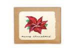 Christmas card with poinsettia design and 'merry Christmas!' text on a kraft paper background.