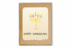 Card with a colorful menorah and 'Happy Hanukkah!' text on a kraft paper background